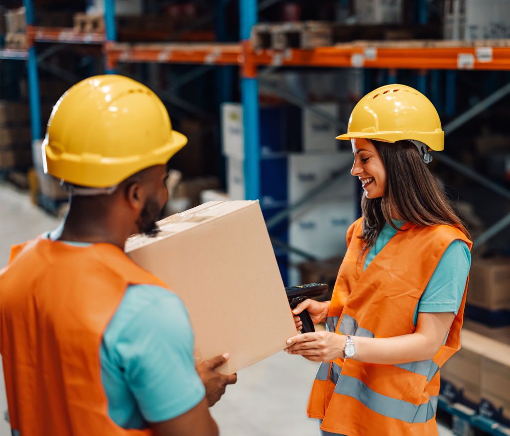 Manual handling - two people carrying cardboard box